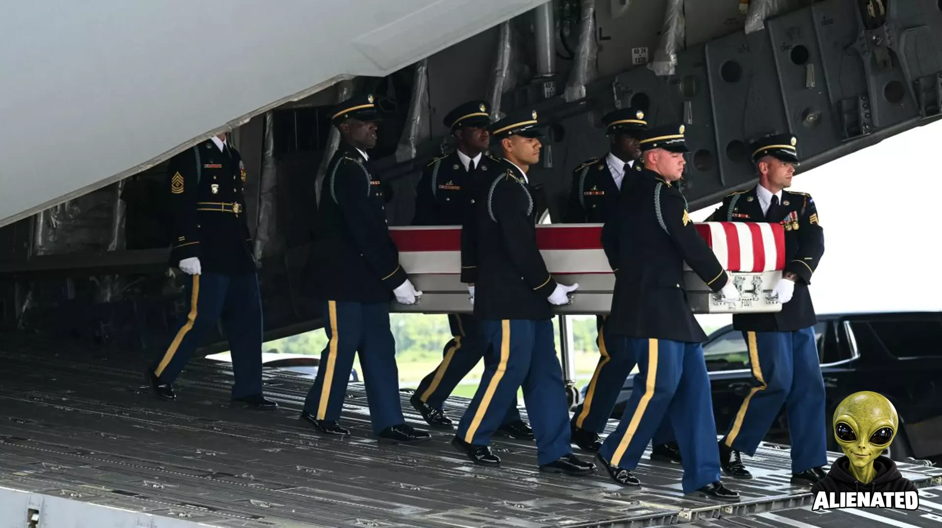 A US Army carry team carries the flag-draped transfer case containing the remains of Sgt. Michael Emmanuel Swinton, 30, of Fayetteville, North Carolina, during a dignified transfer solemn event for US service members killed during operations in the Middle East, at Dover Air Force Base in Dover, Delaware, on July 22, 2026. Swinton was killed in action on July 19 at at Erbil Air Base in Iraq. (Photo by SAUL LOEB / AFP via Getty Images)
