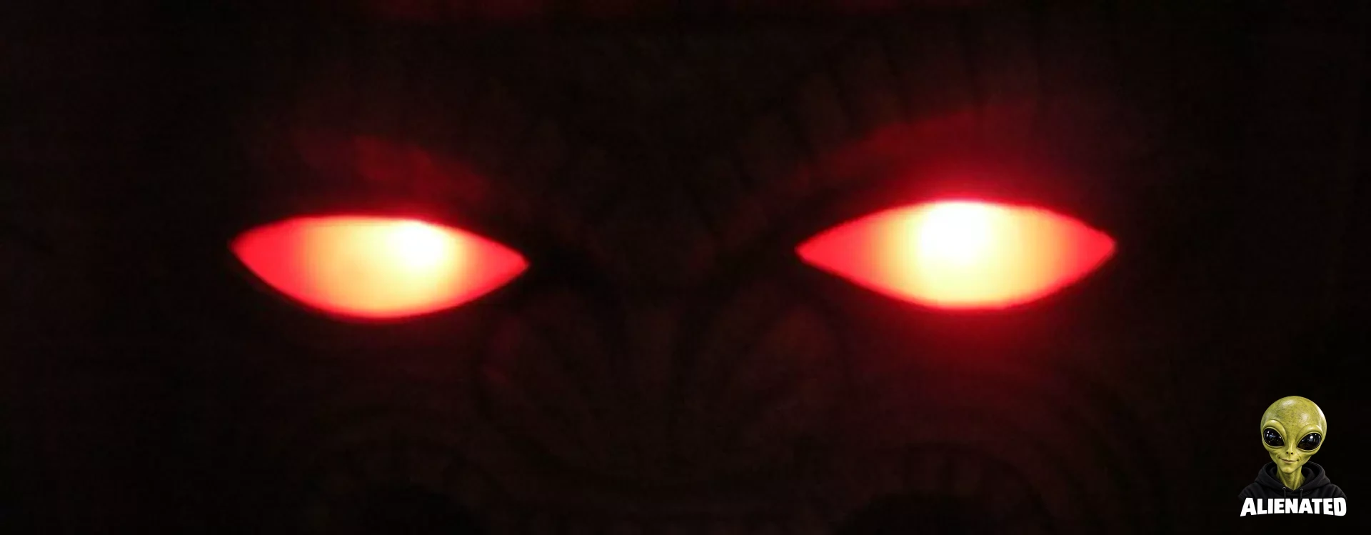 Red Eyes Peer From the Forest