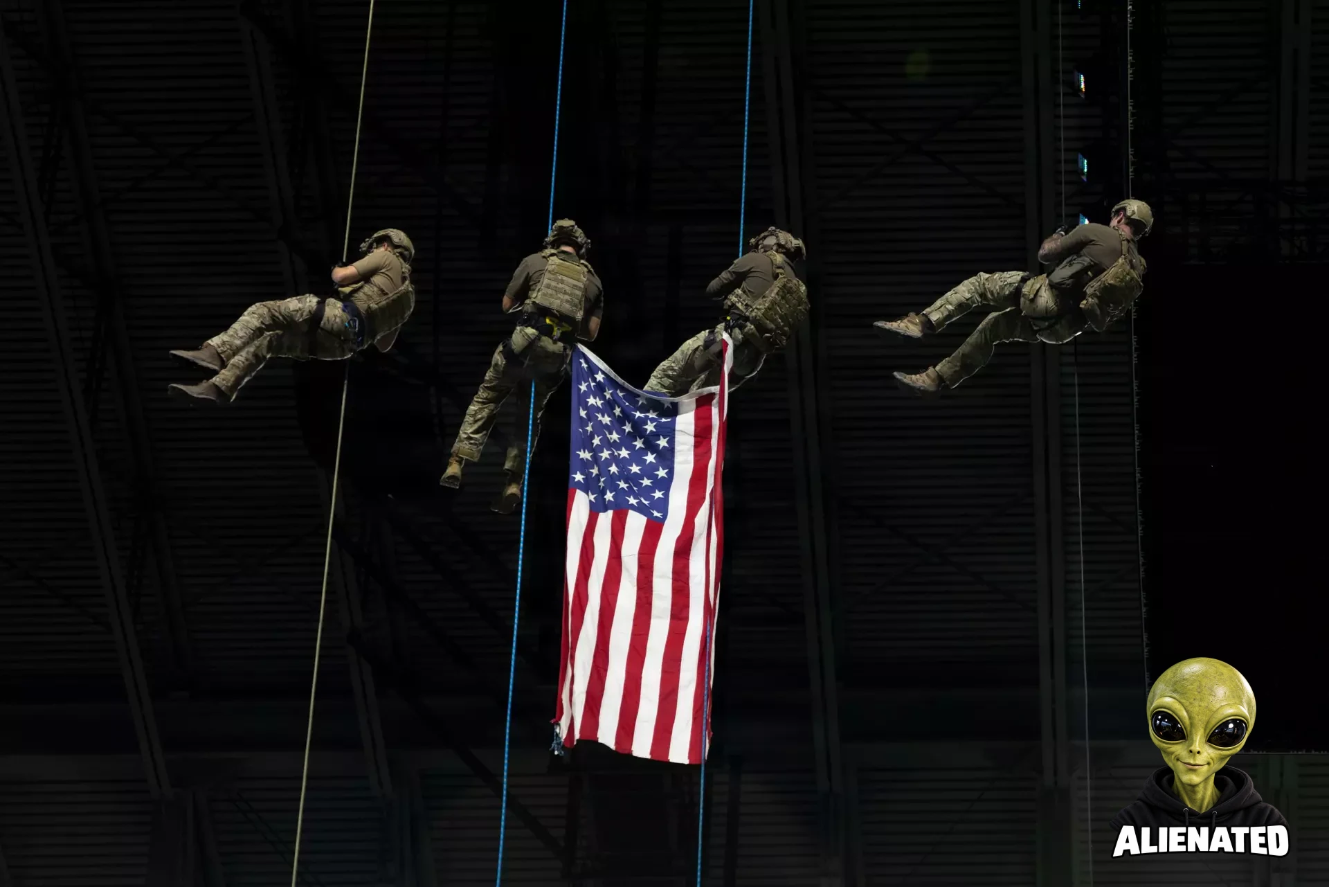 A group of U.S. Army Soldiers repel onto the field with an american flag for the national anthem during an American Conference football game between the Army West Point Black Knights and University of Texas San Antonio Roadrunners in the Alamodome, San Antonio, Texas, Nov. 29, 2025. Each game, the team honors a U.S. Army unit by wearing its insignia on their helmets. In 2025, the 1st Cavalry Division was chosen as the honored unit. (U.S. Army Photo By Spc. David Dumas)